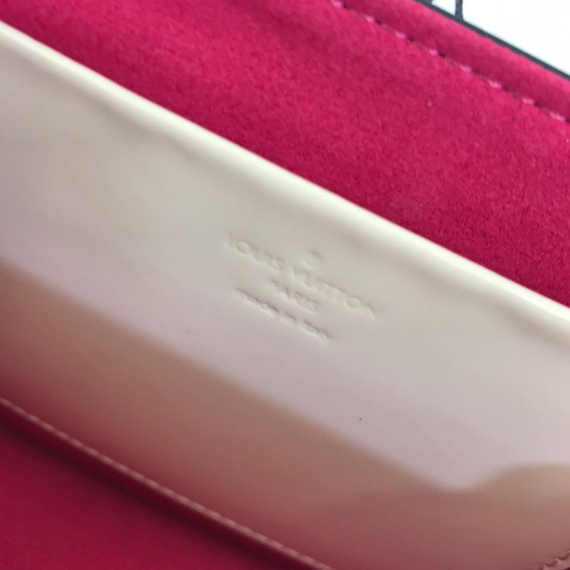 Side profile of refined signature women's handbag – women's luxury handbag