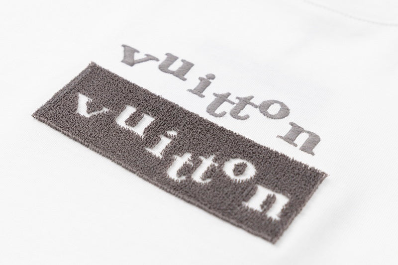 Flat lay presentation of Louis Vuitton cotton t-shirt with logo-detail design