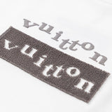Flat lay presentation of Louis Vuitton cotton t-shirt with logo-detail design