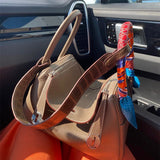 Elegant top-handle bag carried on shoulder