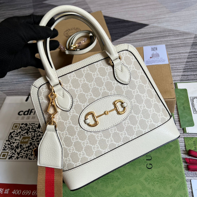 Handle and strap detail of signature elevated women's handbag – women's statement bag