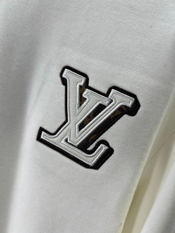 Front view of Louis Vuitton luxury clothing with logo-detail design