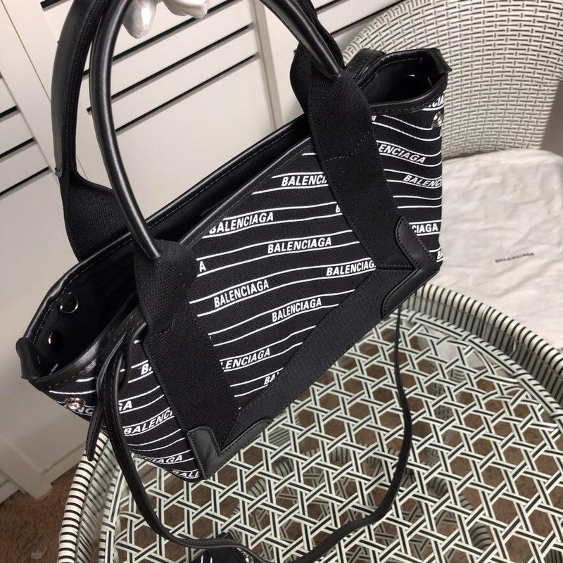 Styled lifestyle shot of chic polished women's handbag – women's luxury handbag