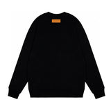 Side profile of Louis Vuitton luxury clothing with logo-detail design
