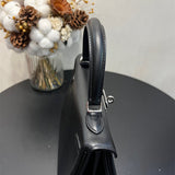 Side view of sophisticated structured handbag