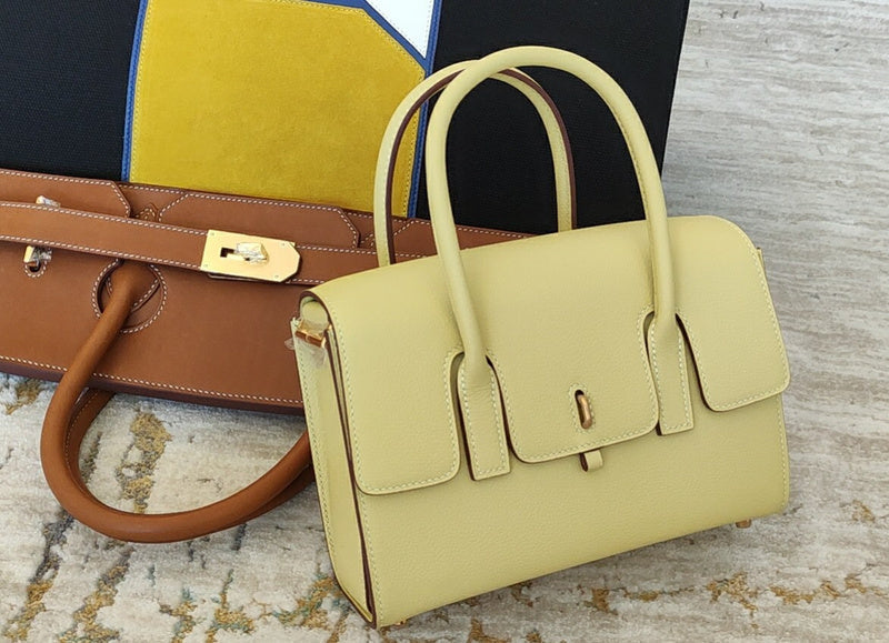 Side view of sculpted structured handbag