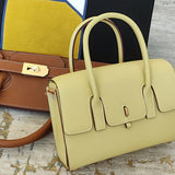 Side view of sculpted structured handbag