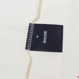 Front view of Rhude luxury clothing with contemporary cut