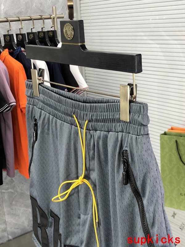 Front view of Rhude luxury clothing with monogram-inspired silhouette