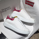Alexander McQueen fresh white-and-black luxury sneakers view 6 signature lace-up style