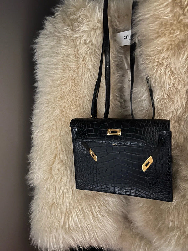 Side view of curated structured handbag