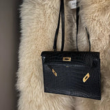 Side view of curated structured handbag