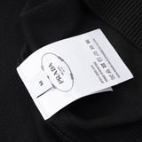 Close-up detail shot of Polo cotton polo shirt with monogram-inspired silhouette