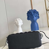 Top view of polished chic women's handbag – women's designer-style accessory