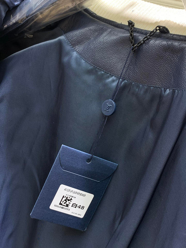 Back view of Louis Vuitton luxury clothing with label-forward styling