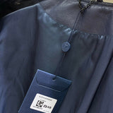 Back view of Louis Vuitton luxury clothing with label-forward styling