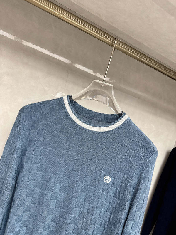 Front view of Louis Vuitton luxury clothing with signature branding