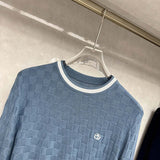 Front view of Louis Vuitton luxury clothing with signature branding