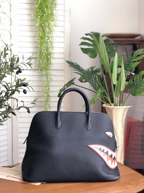 Side view of sleek structured handbag