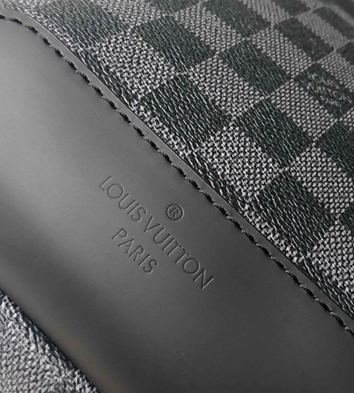 Handle and strap detail of classic signature women's handbag – women's designer-style accessory