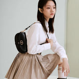 Close-up detail of refined chic women's handbag – women's designer-style accessory