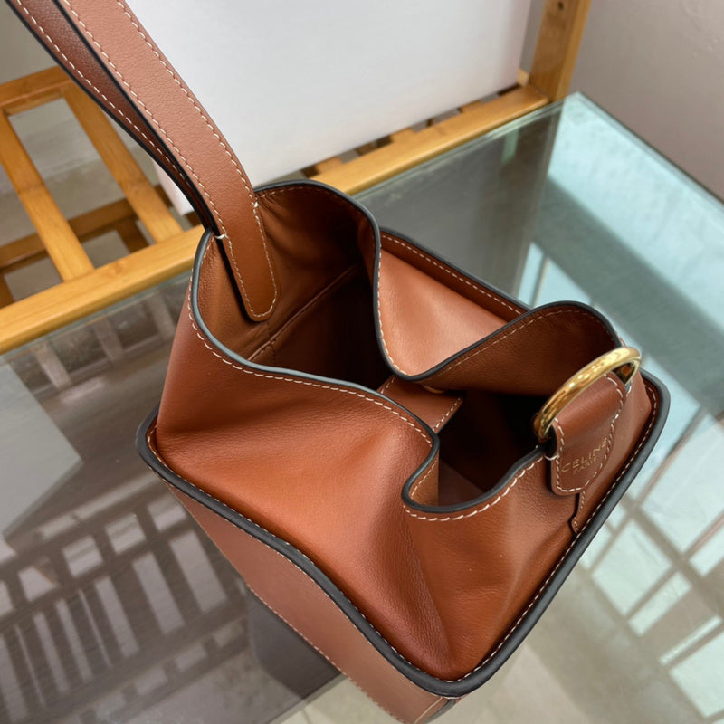Side profile of structured signature women's handbag – women's designer-style accessory