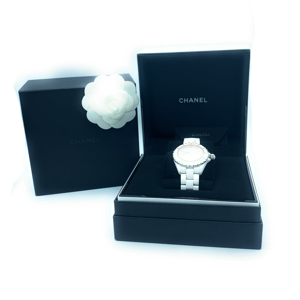 Side view of Chanel unisex white watch