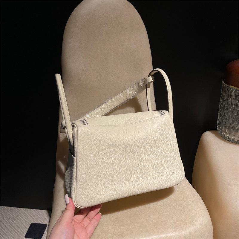 Side view of tailored structured handbag