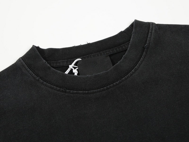 Close-up detail shot of Givenchy luxury clothing with signature branding