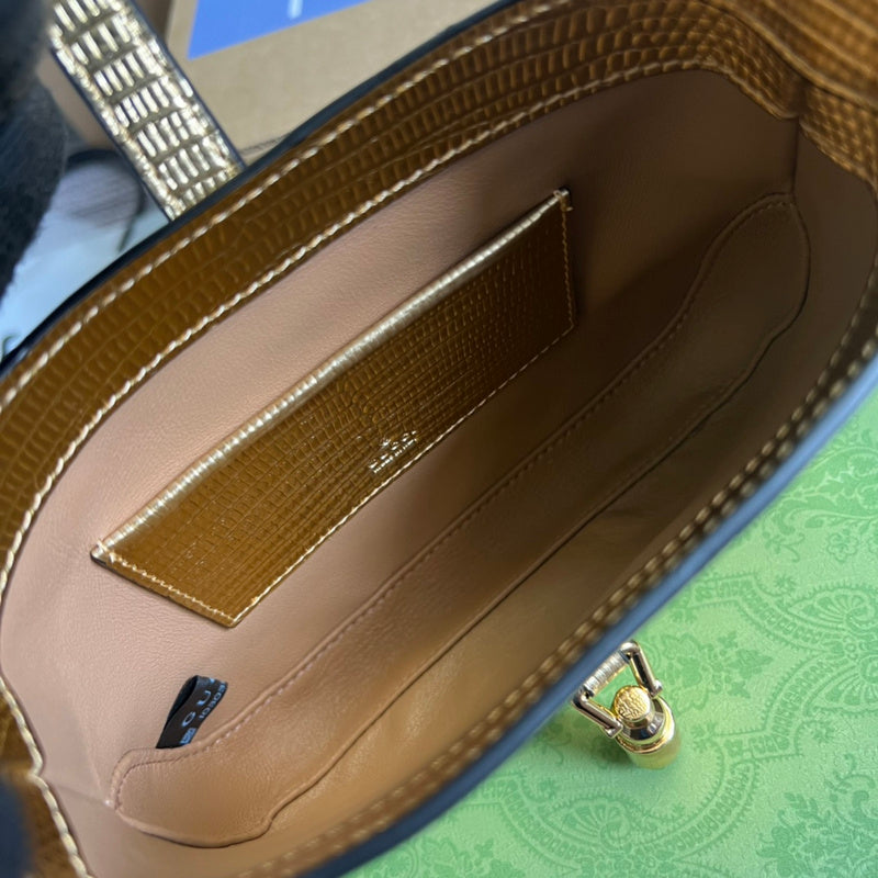 Side profile of elevated modern women's handbag – women's luxury accessory
