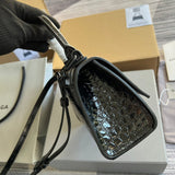 Handle and strap detail of classic modern women's handbag – women's designer-style accessory