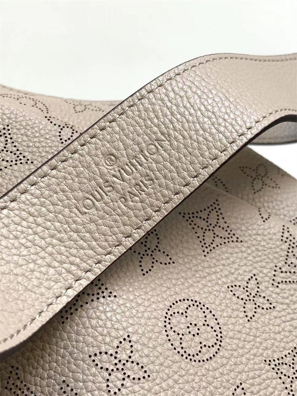  Signature top-handle bag carried on shoulder 10