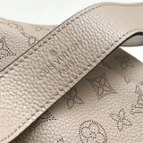  Signature top-handle bag carried on shoulder 10