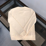 Close-up detail shot of Gucci luxury clothing with relaxed-fit cut