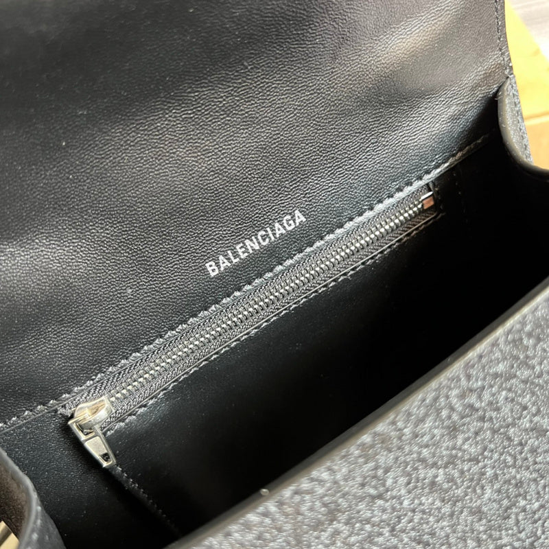 Close-up detail of classic signature women's handbag – women's designer-style accessory