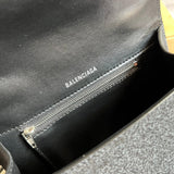 Close-up detail of classic signature women's handbag – women's designer-style accessory