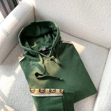 Side profile of Gucci luxury clothing with logo-detail design