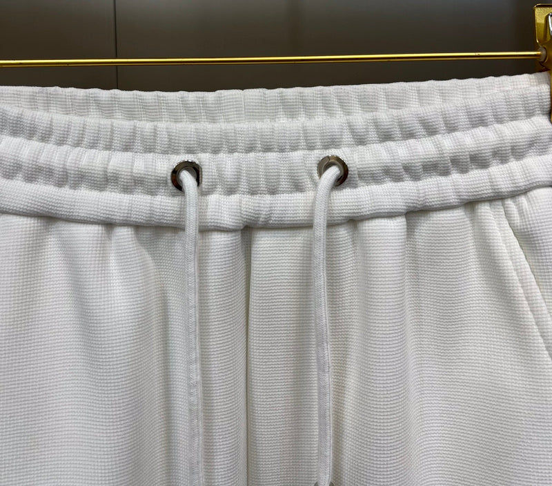 Close-up detail shot of Louis Vuitton luxury clothing with runway-inspired design