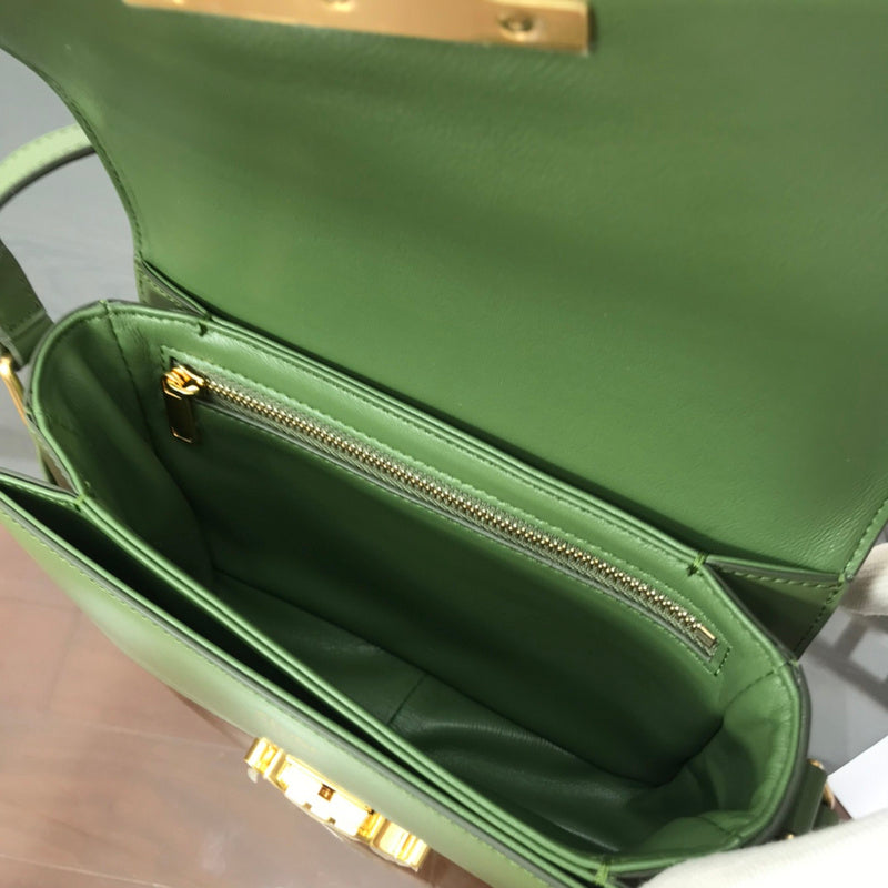 Handle and strap detail of modern structured women's handbag – women's designer-style accessory