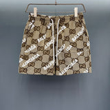 Front view of Gucci luxury clothing with monogram-inspired silhouette