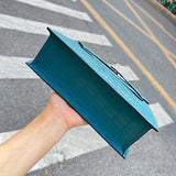 Side view of minimalist structured handbag