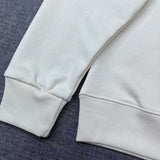 Close-up detail shot of Gucci luxury clothing with signature branding