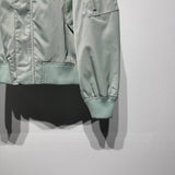 Close-up detail shot of Louis Vuitton luxury clothing with everyday silhouette