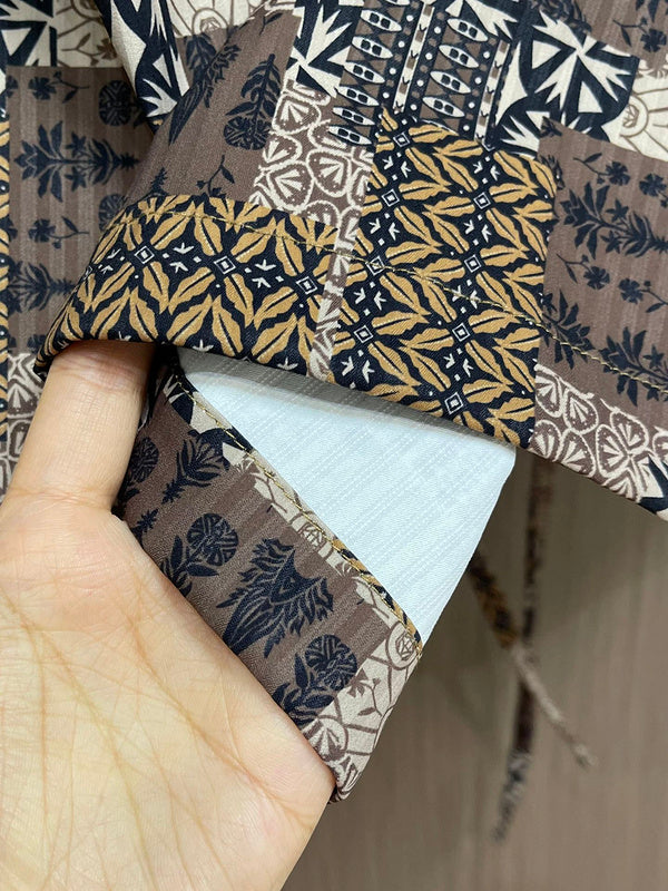 Close-up detail shot of Louis Vuitton luxury clothing with logo-detail design