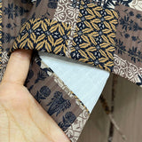 Close-up detail shot of Louis Vuitton luxury clothing with logo-detail design