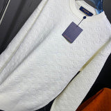 Close-up detail shot of Louis Vuitton luxury clothing with runway-inspired design