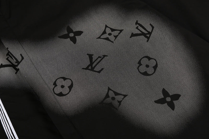 Flat lay presentation of Louis Vuitton luxury clothing with monogram-inspired silhouette