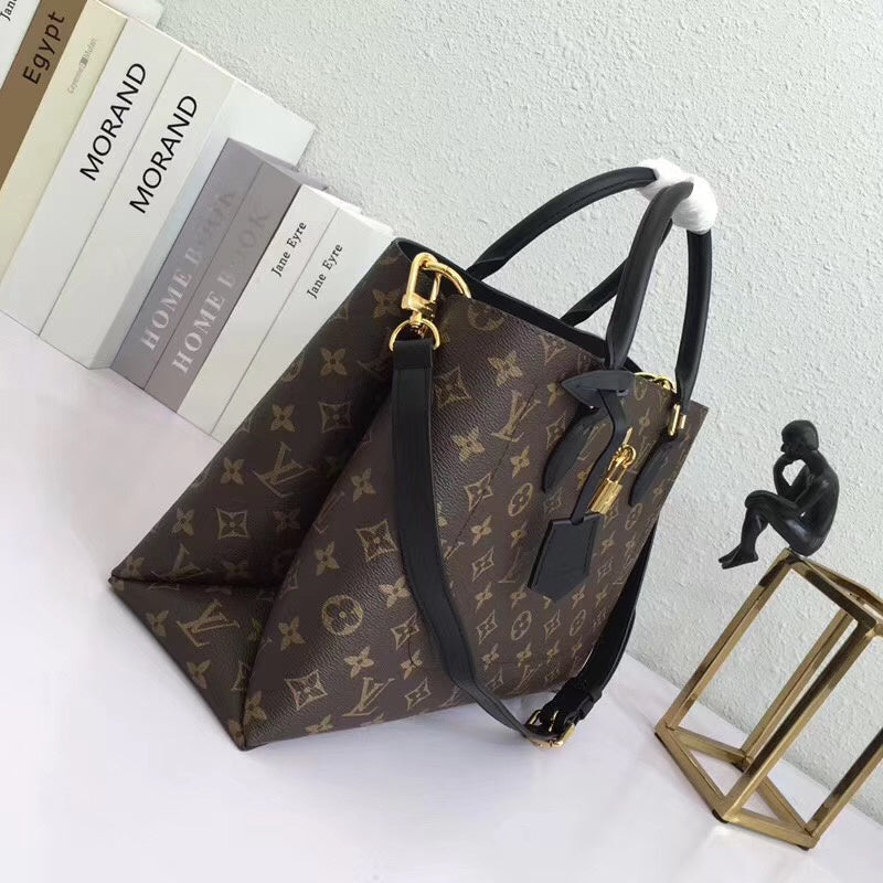 Close-up detail of structured everyday-luxe women's handbag – women's luxury handbag