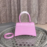 Styled lifestyle shot of statement modern women's handbag – women's luxury accessory