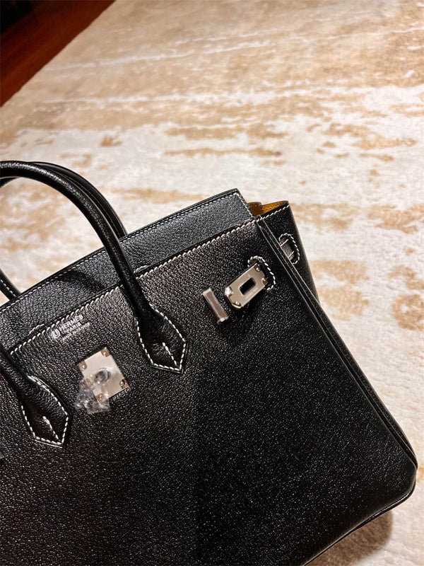 Side view of classic structured handbag